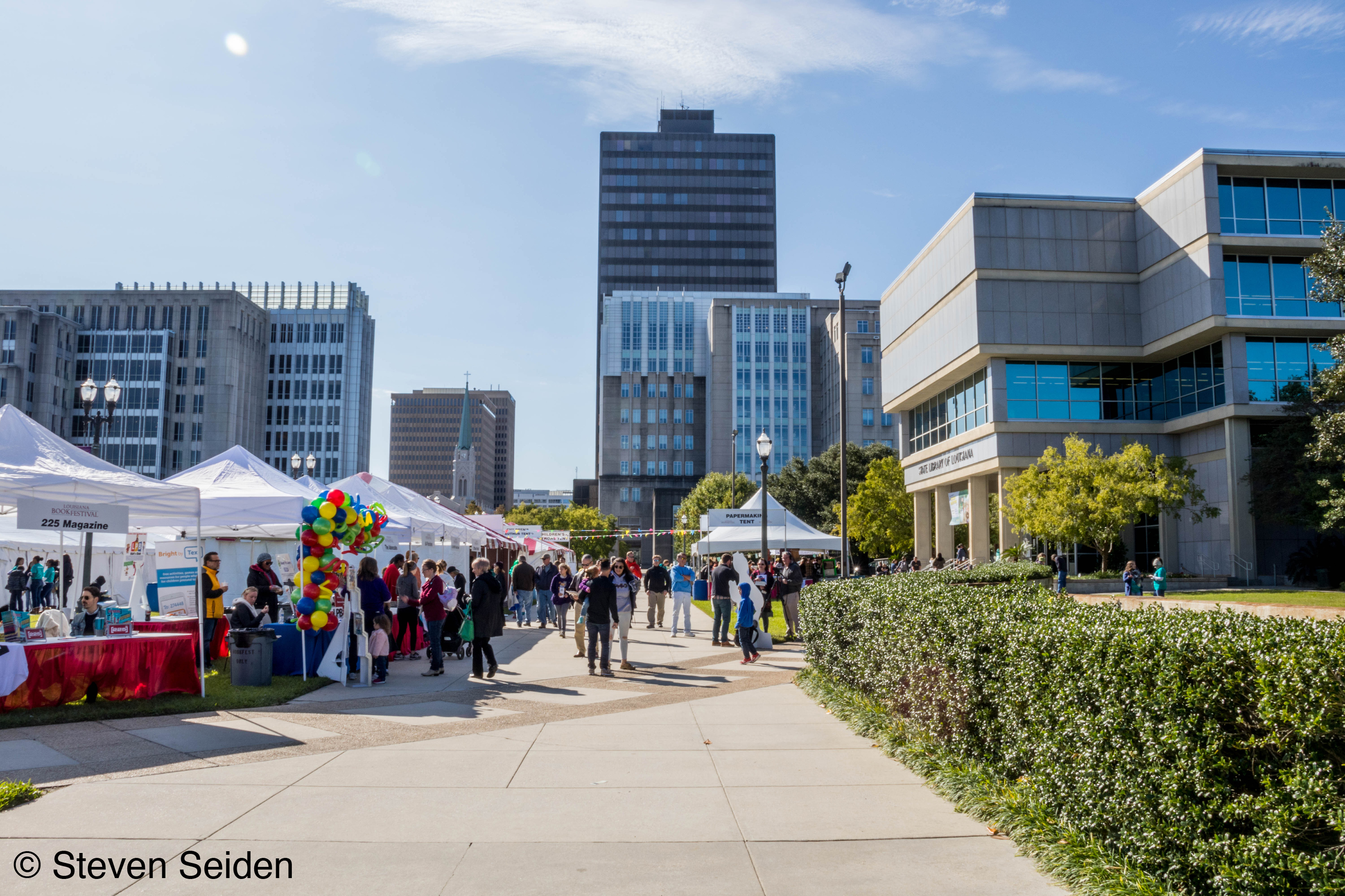 A picture of a festival in a city.